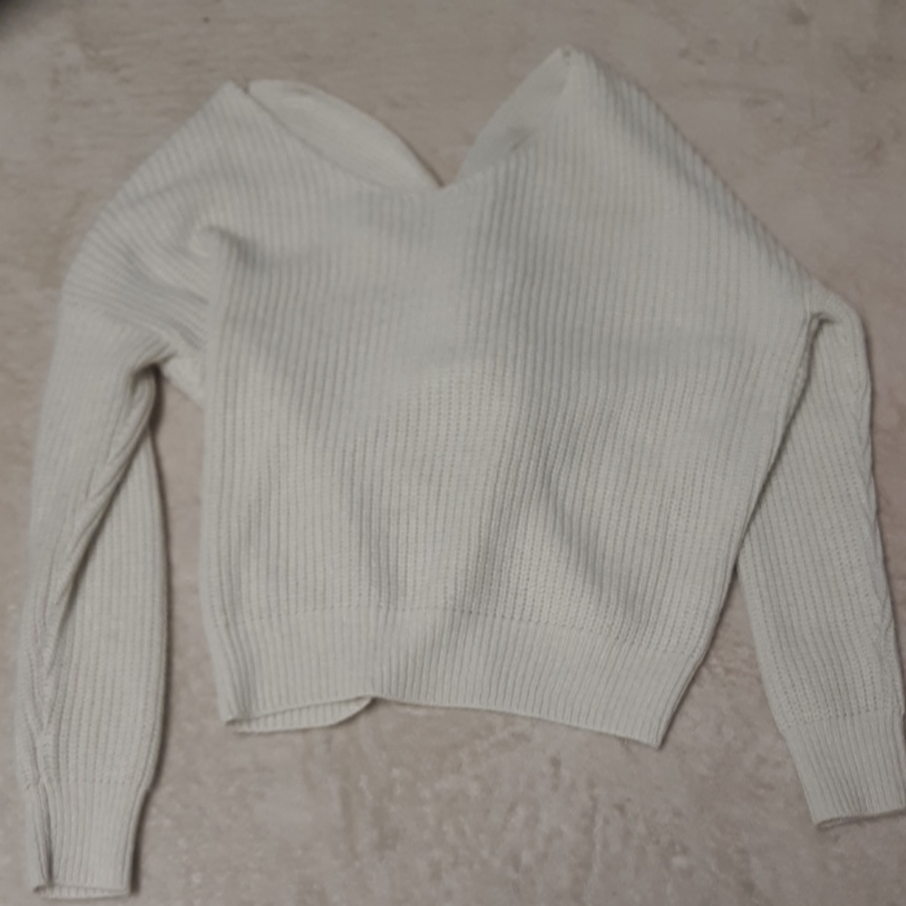 Cream sweater with knotted back